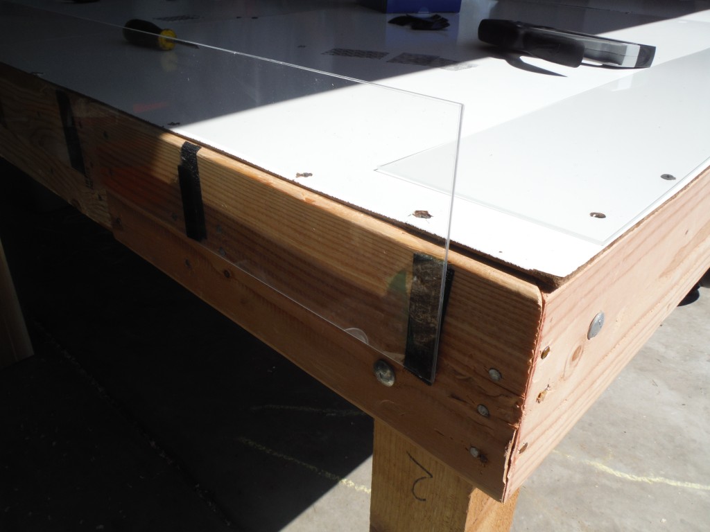 The side bumpers adhered to the table with Velcro