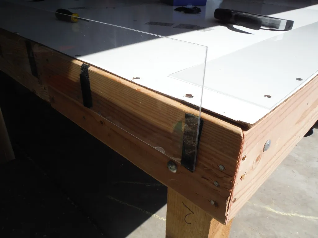The side bumpers adhered to the table with Velcro
